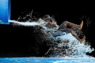 Illustration for article titled The Absurd Joy Of Waterslides Is Captured In These Perfectly Timed Shots